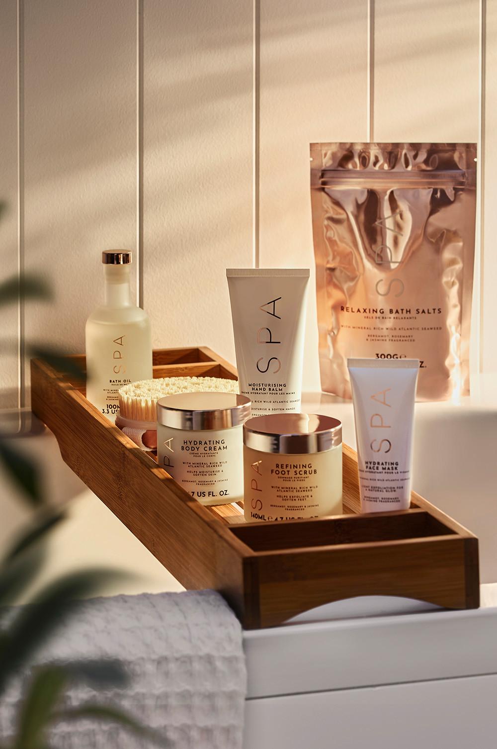 Spa product set up with products on a bath shelf