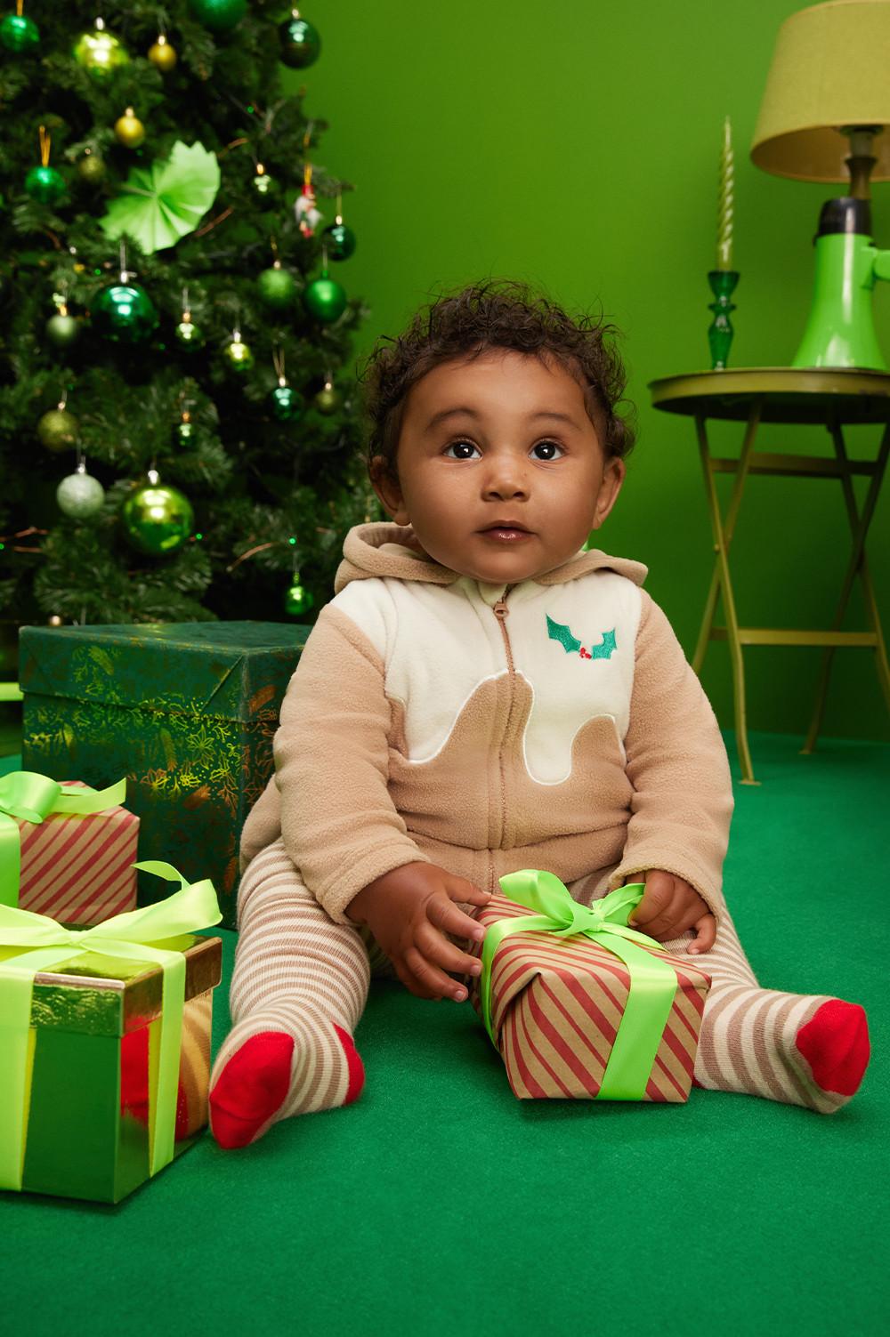 Dítě v bodýčku s motivem vánočního pudingu