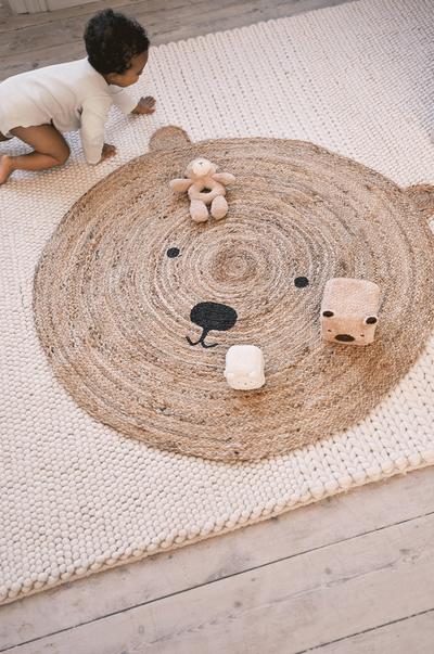 Woven teddy rug with toys