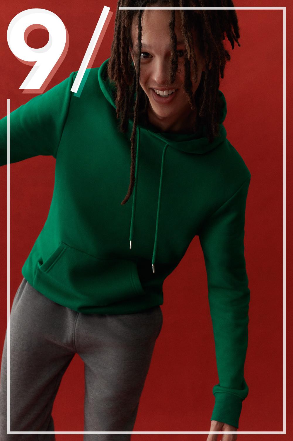 Model wears green hoodie