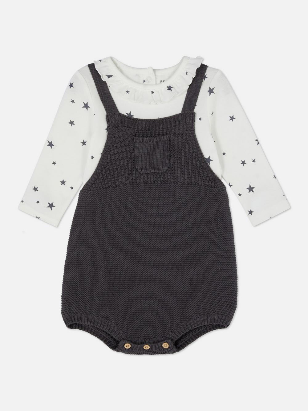 Baby romper in black with white star print top