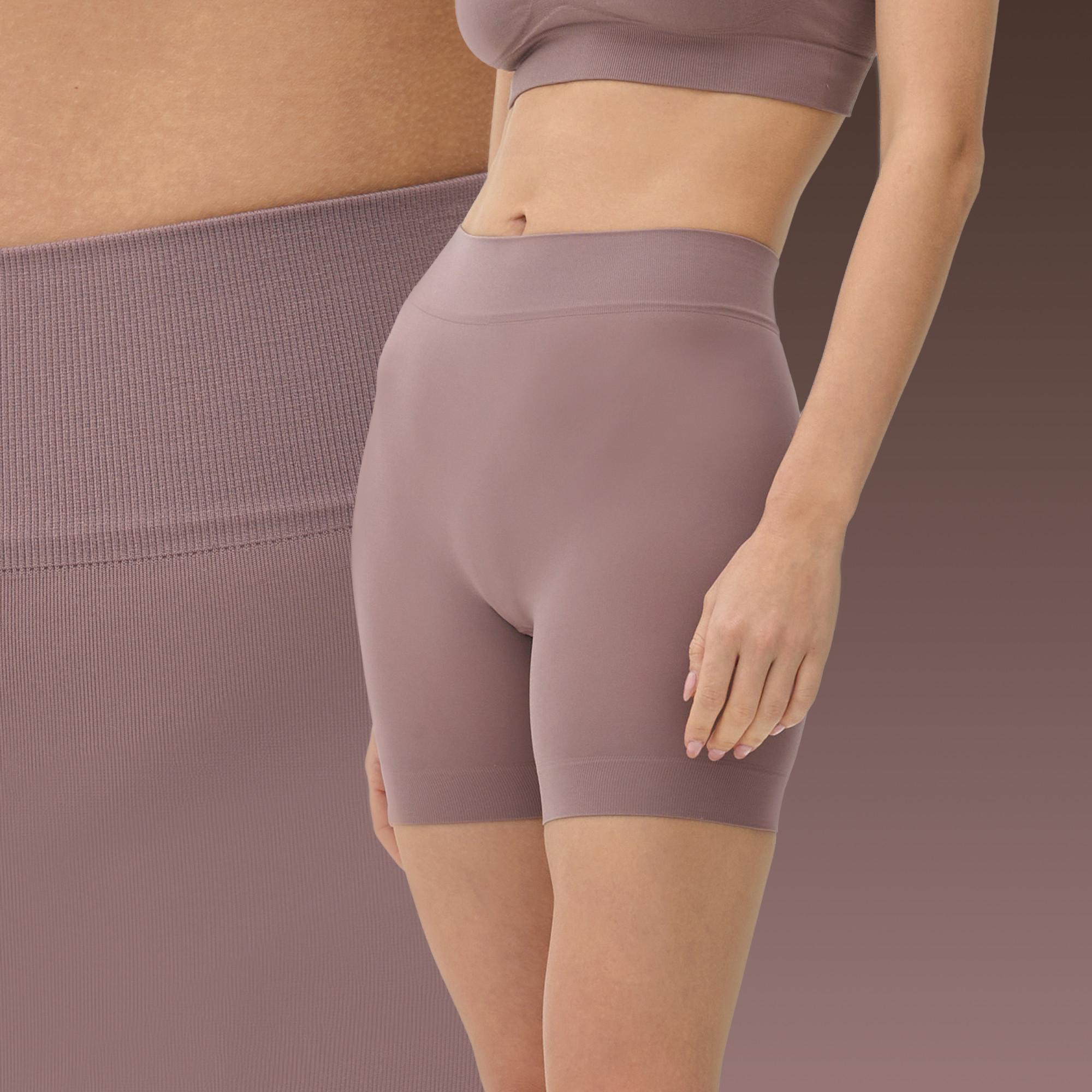 Mauve high-waisted compression shorts with matching sports bra, shown on a torso model.