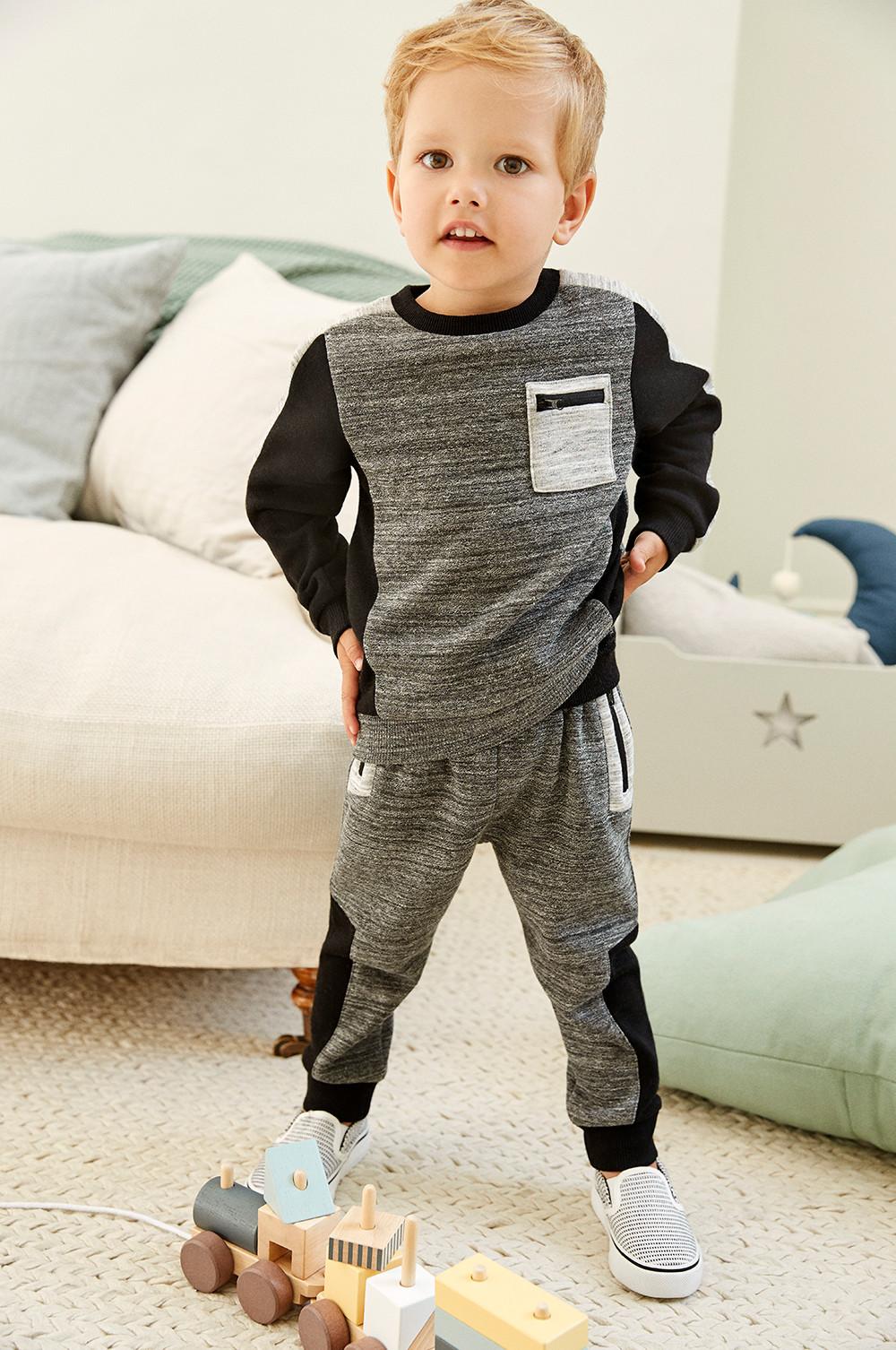 toddler in tracksuit