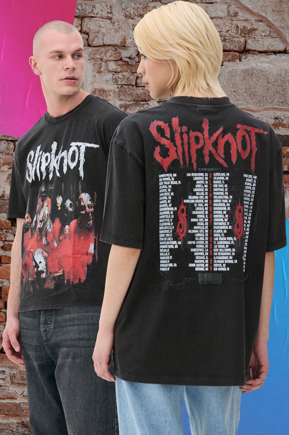 Two model wearing Slipknot graphic T-shirts with tour dates on the back.
