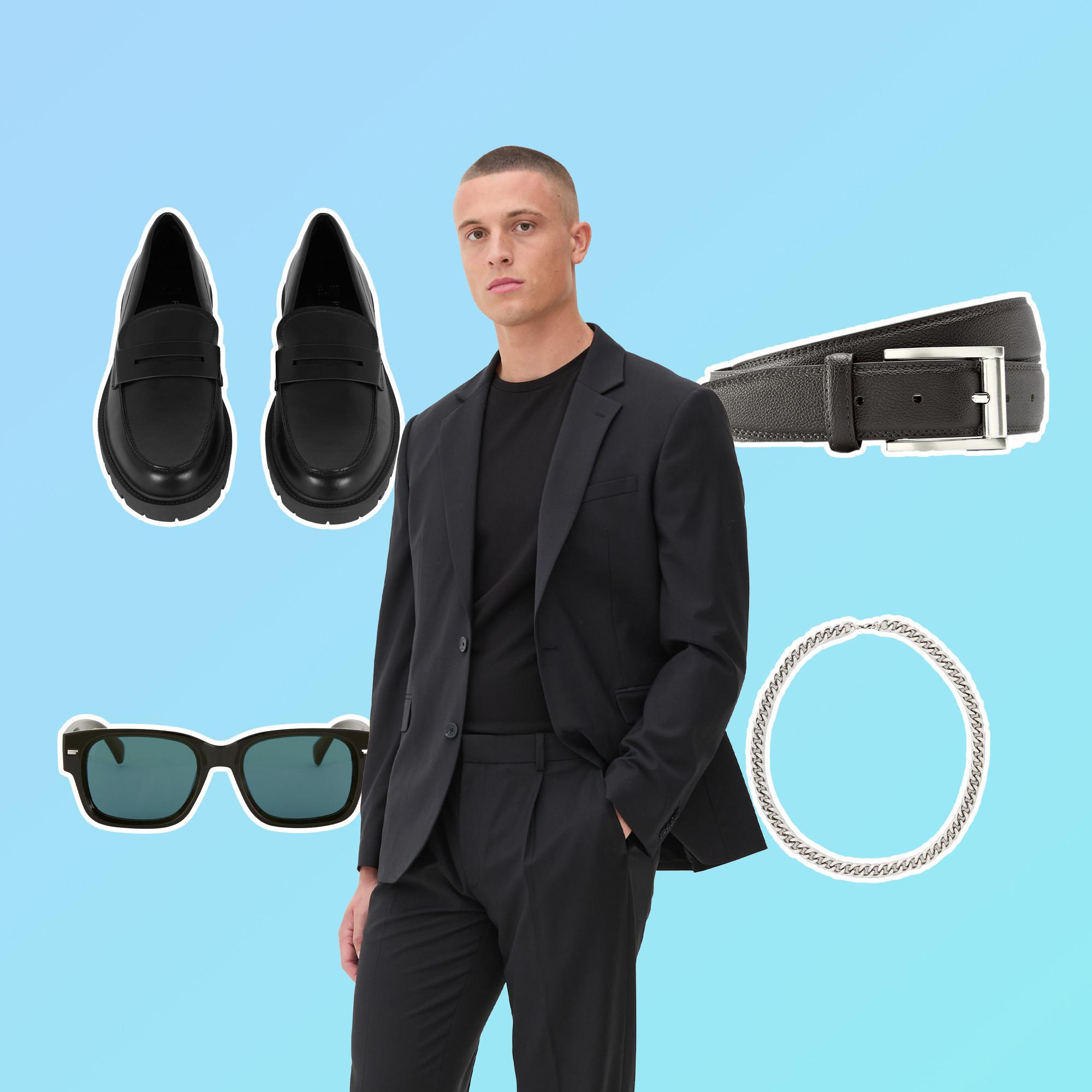Mann in schwarzen Anzug mit schwarzen Schuhen, Gürtel, Sonnenbrille und silberfarbenem Armband.