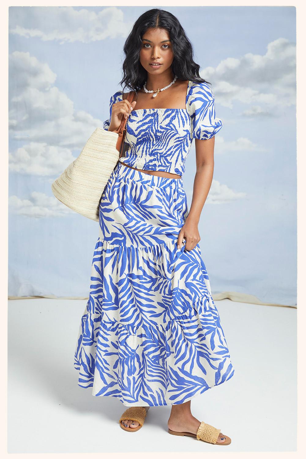Model wears blue and white printed co-ord