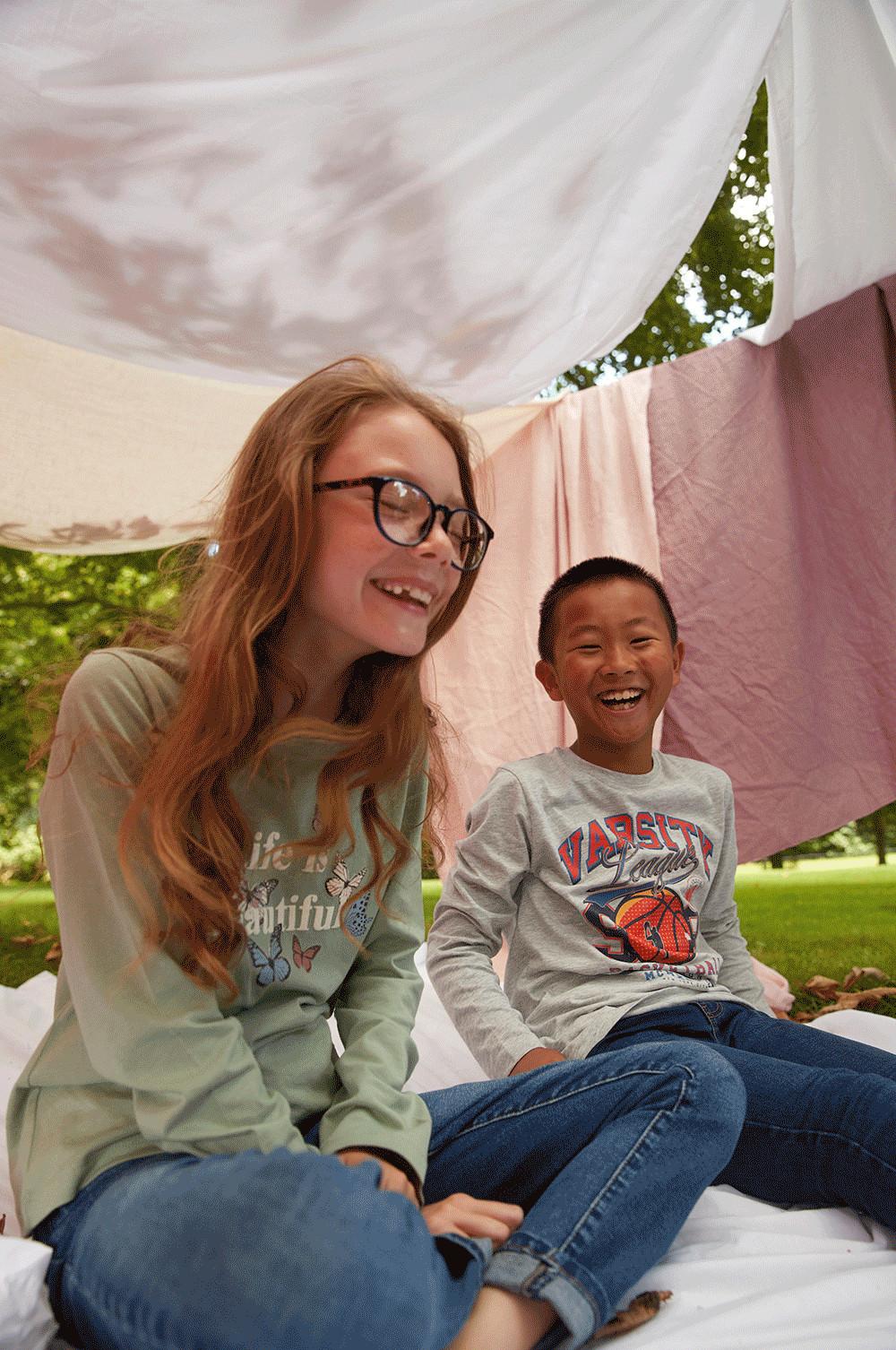 Two girls in slogan tops