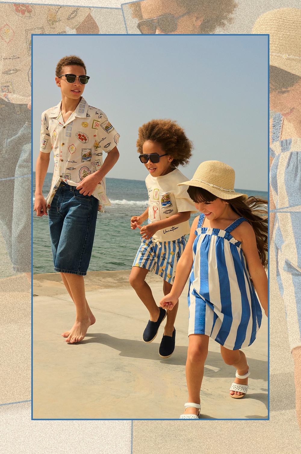 Three models wearing coordinating holiday-themed shirts and shorts outdoors on a sunny day.