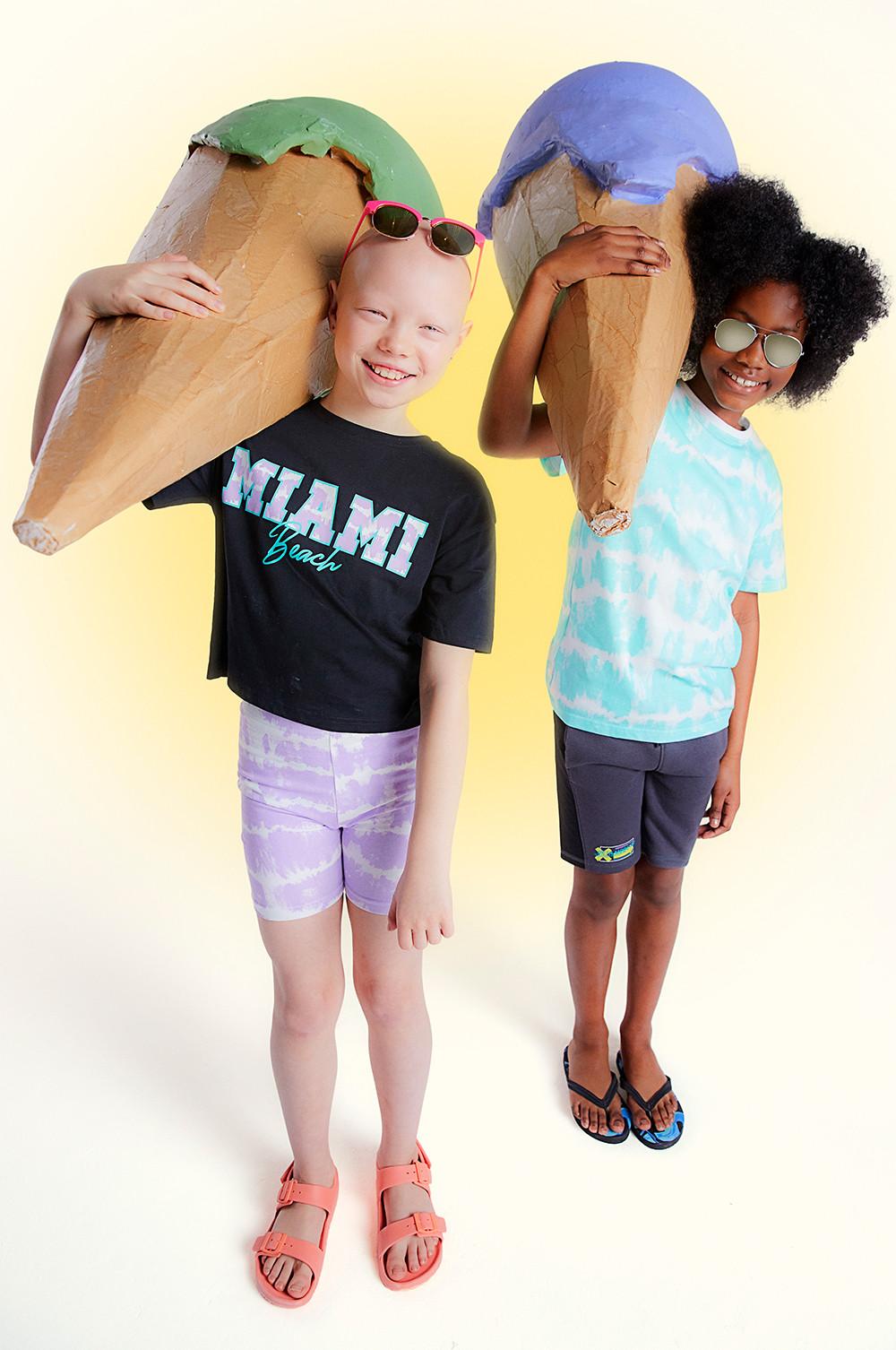 Older Child Miami Graphic T-Shirt & Tie Dye Shorts Set, Child’s Pink Ombré Lens Sunglasses, Older Child Light Blue Tie Dye T-Shirt, Older Child Black Shorts, Aviator Sunglasses