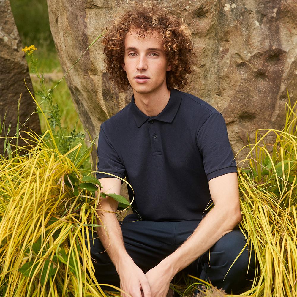 Man in grass, navy top