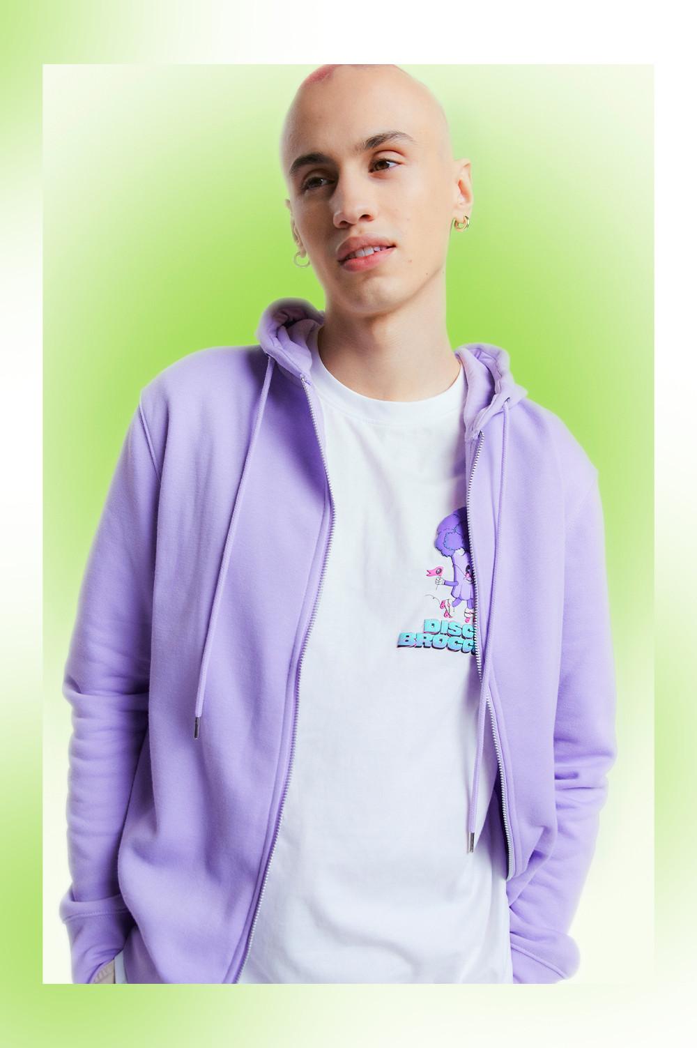 Model wears purple zip hoodie