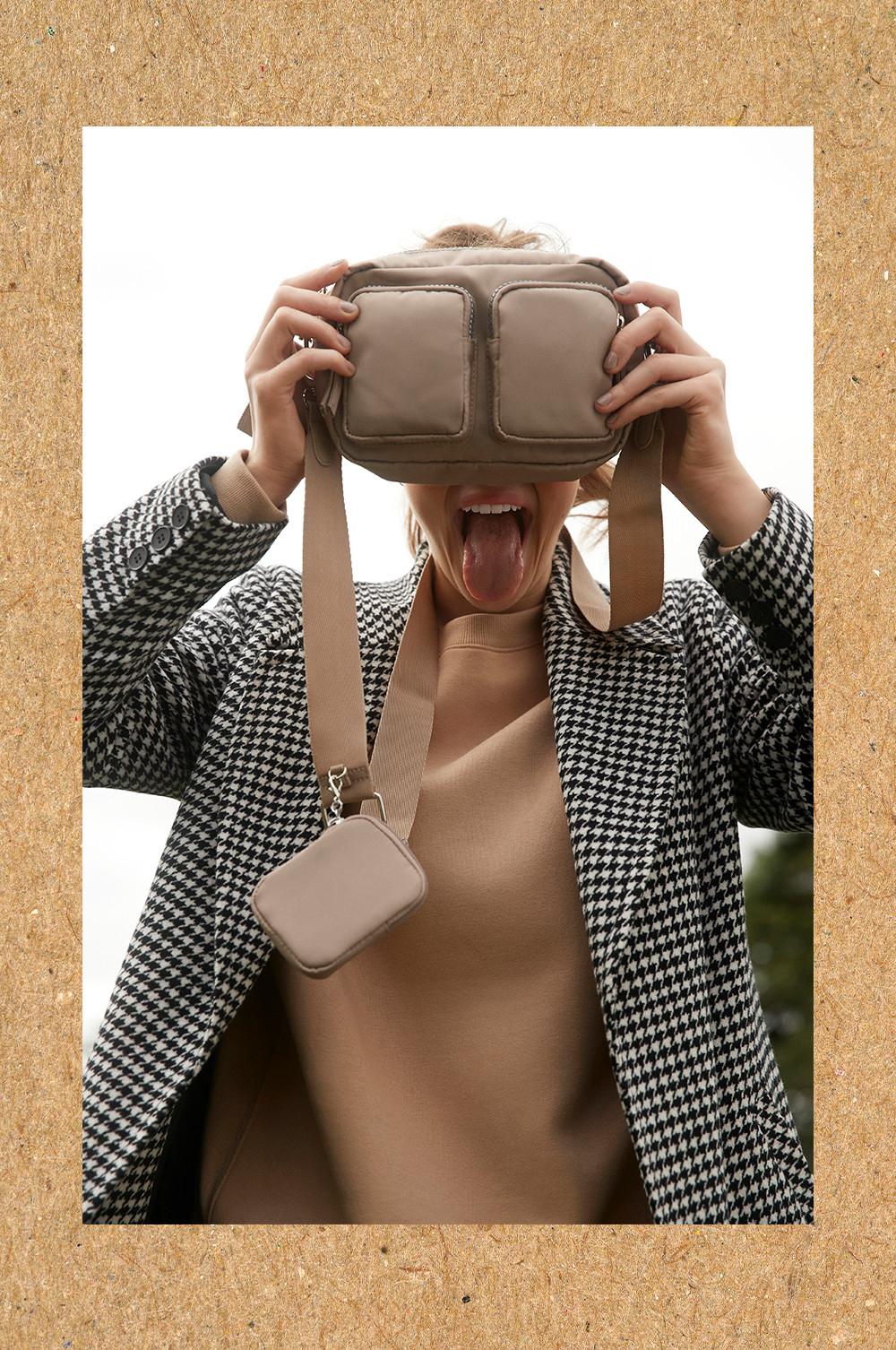 Model with bag over face