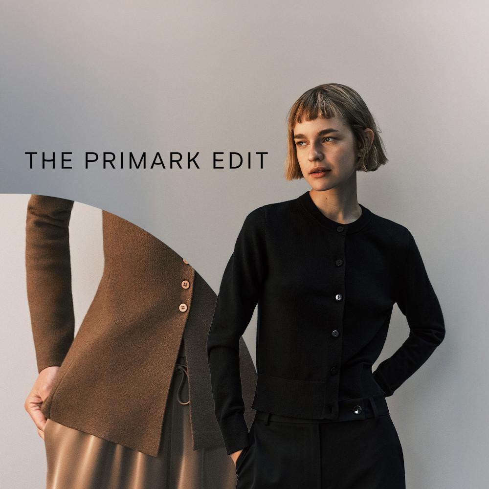Person wearing a black button-up cardigan with a brown garment visible to the left. THE PRIMARK EDIT text overlay.