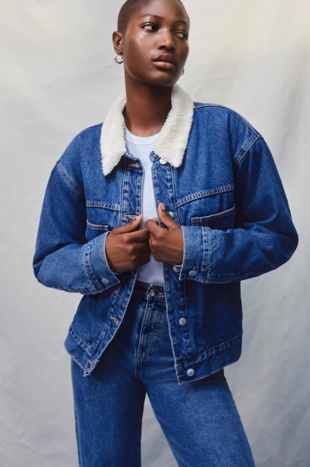 Model wearing borg denim jacket and jeans