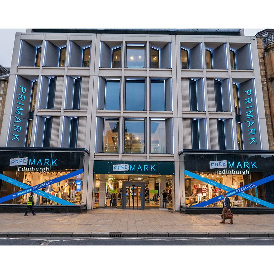Exterior of Edinburgh Primark store with rebranded signs that say 'Preemark'.