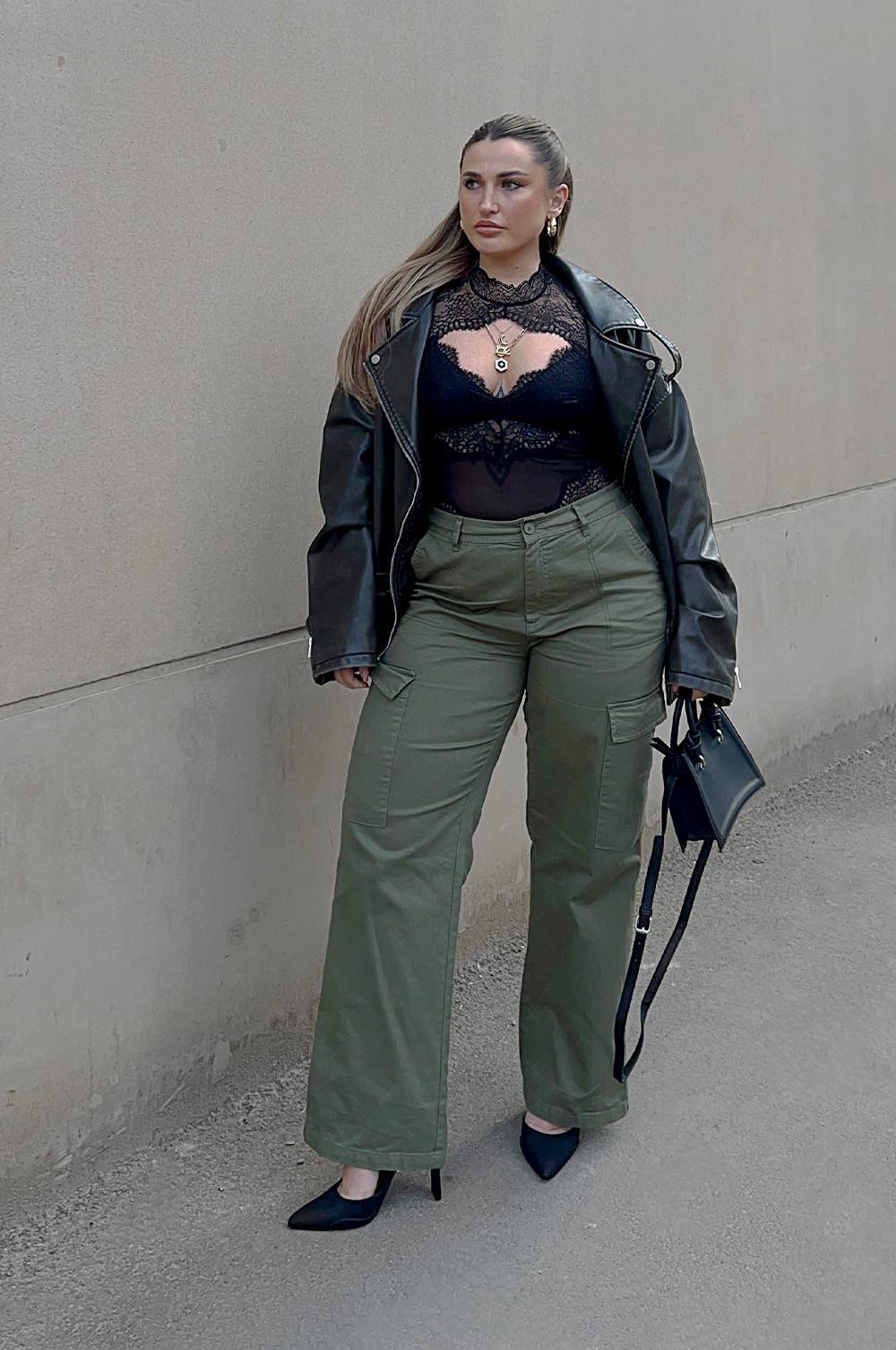 Faye wears green cargo trousers