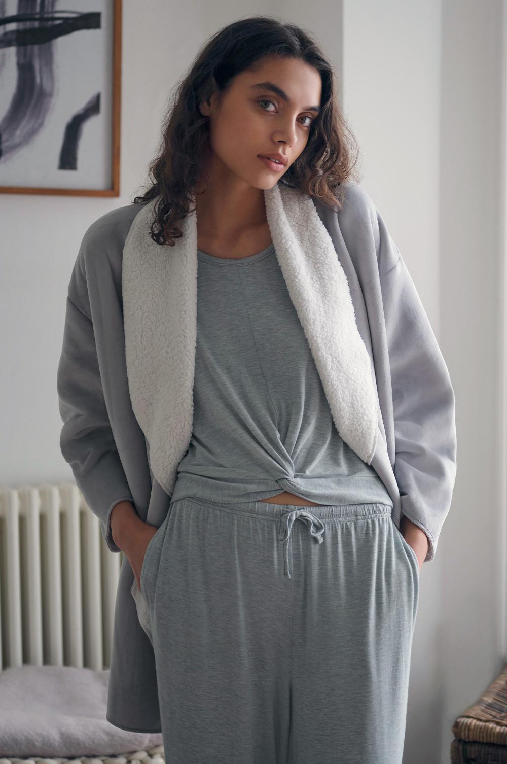 model wears grey sherpa dressing gown
