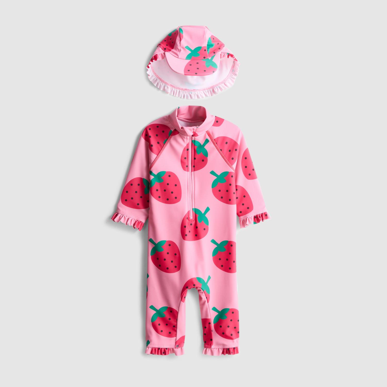 Pink baby swimsuit with strawberry print and matching sun hat with ruffle trim.