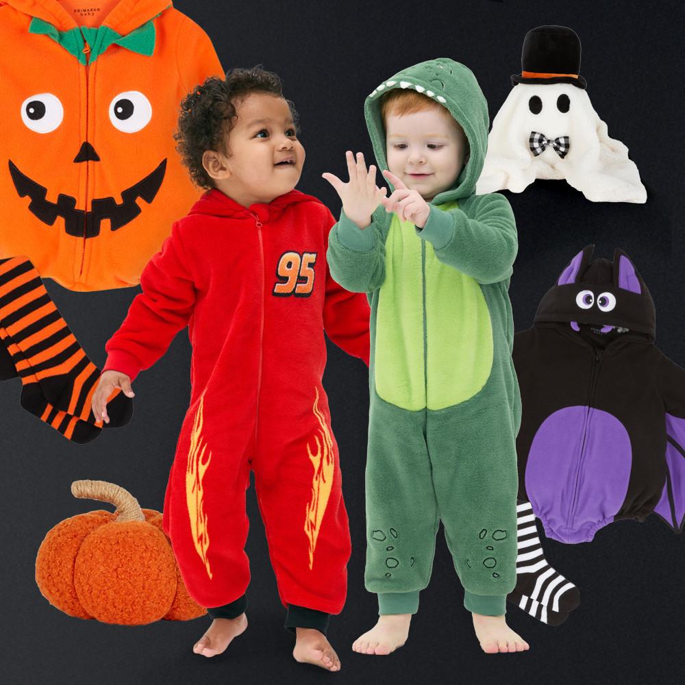 Children wearing Halloween costumes including a dinosaur all in one and red racing outfit, with pumpkin, ghost and bat costumes displayed around them.