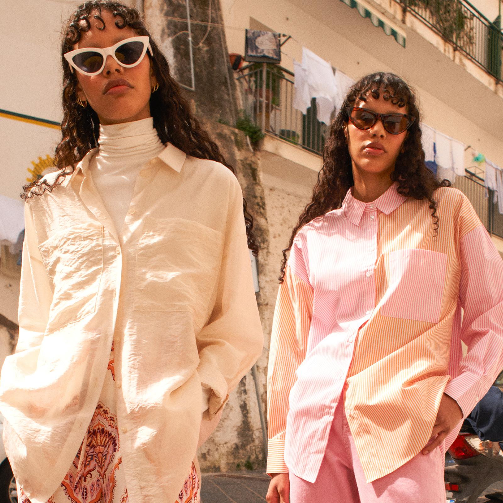 Women wearing pink and yellow shirts and trousers