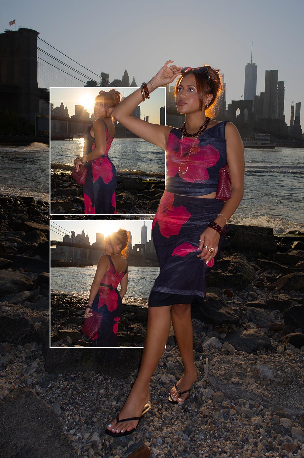 Model wearing skirt and top co-ord with pink flower print, paired with black flip flops and clutch bag