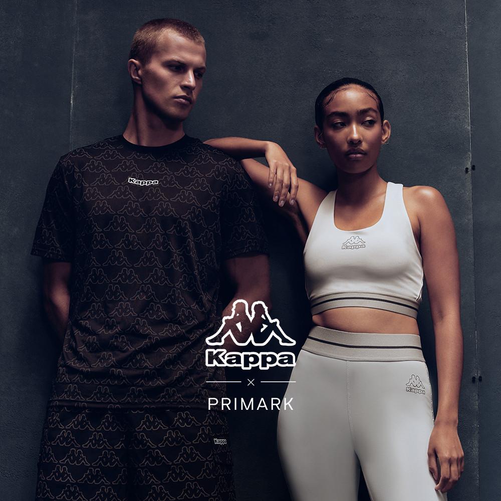 Two models wearing Kappa x Primark sportswear collection featuring dark t-shirt and white crop top with leggings.