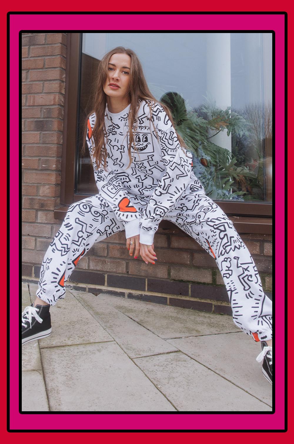 model wears keith haring tracksuit