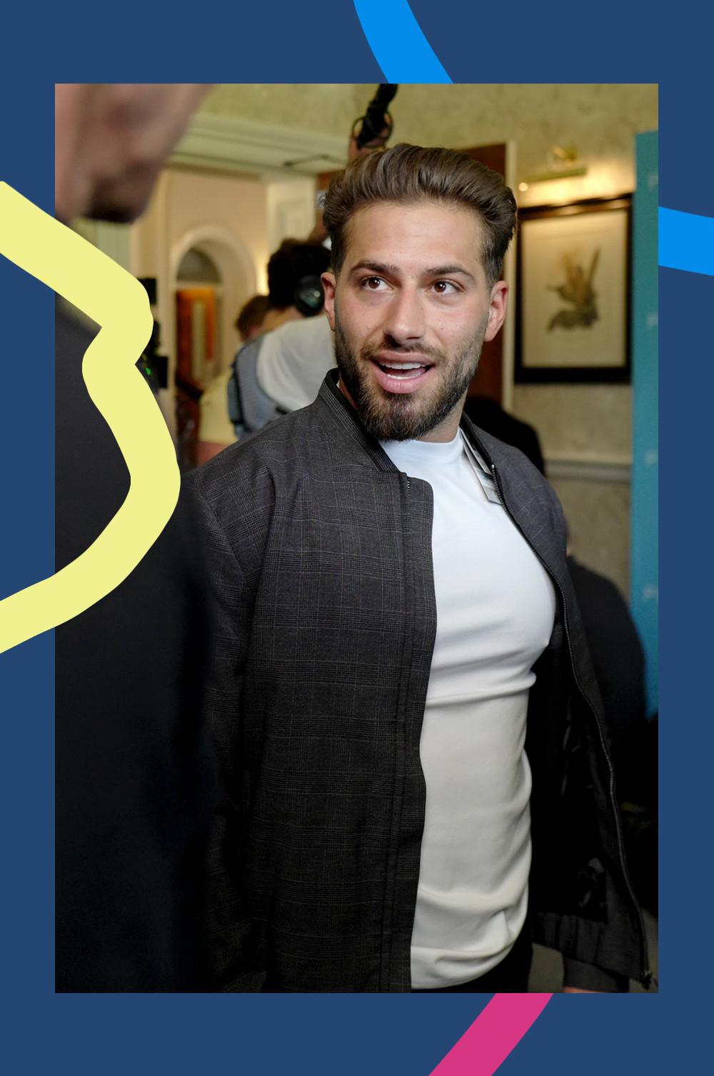 Kem wearing a bomber jacket