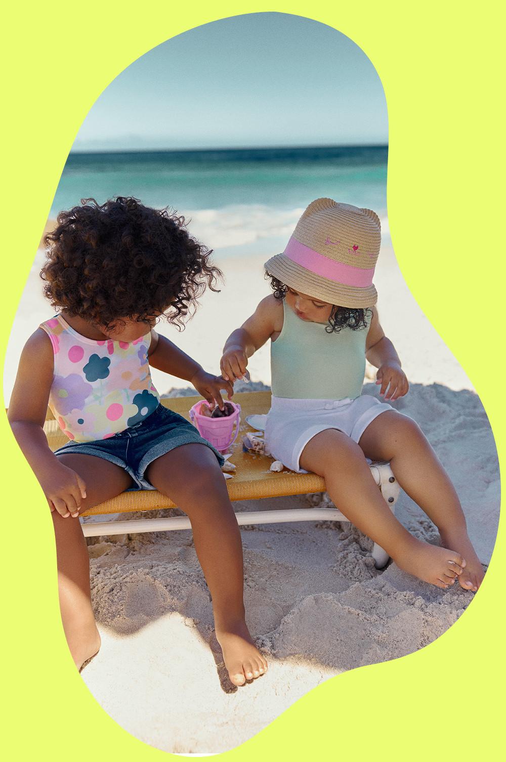 Children wear swimsuits, shorts and hats