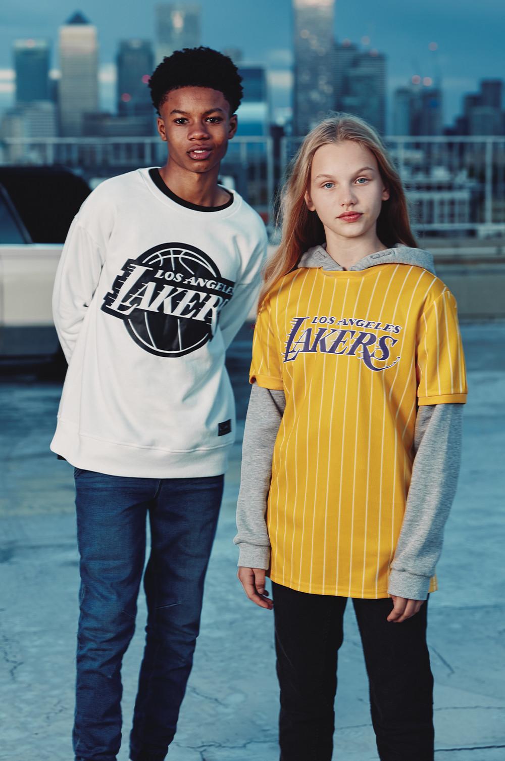 Kids wear Lakers tops