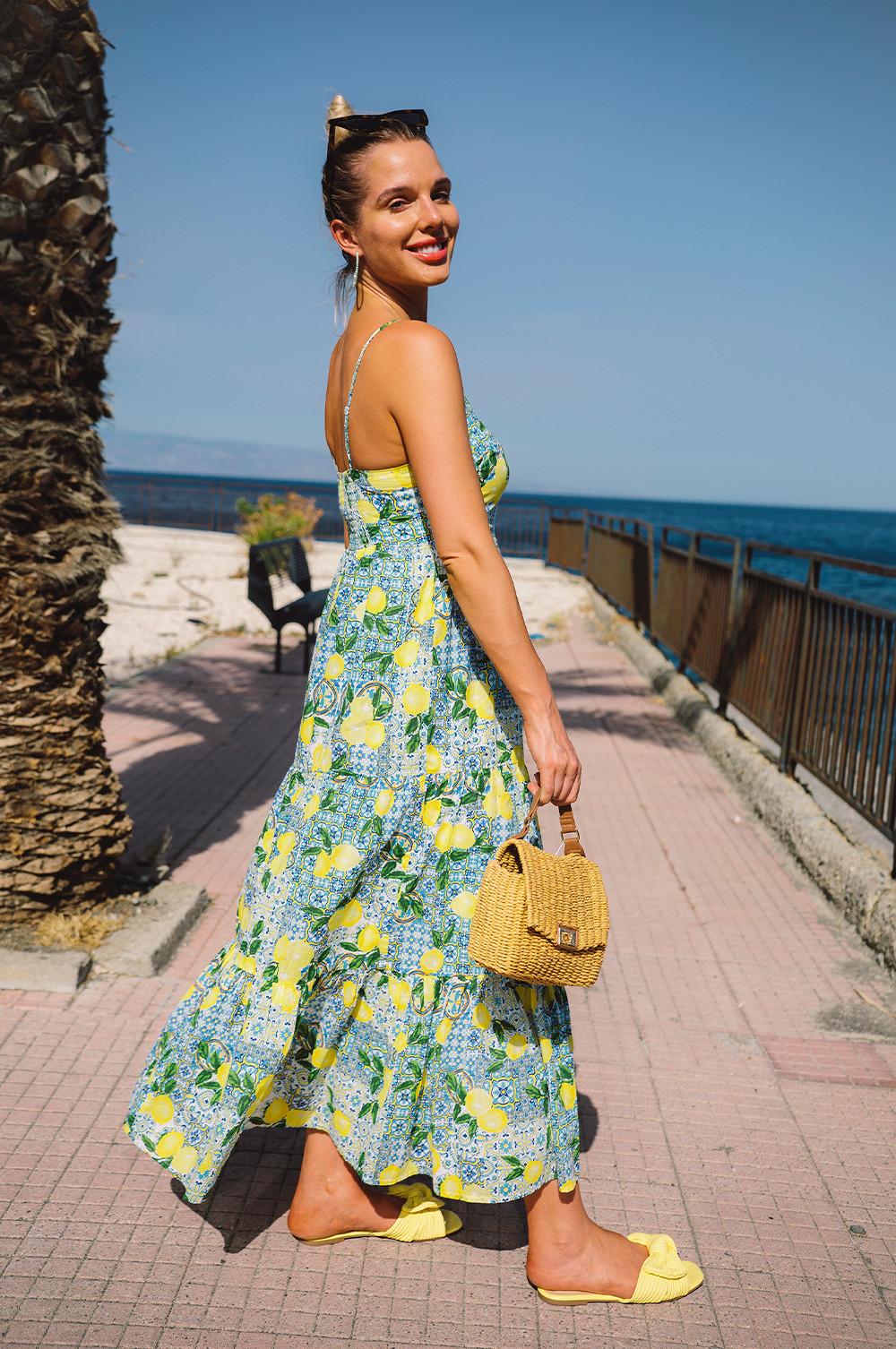 Helen in lemon print midi dress, yellow shoes, rattan bag