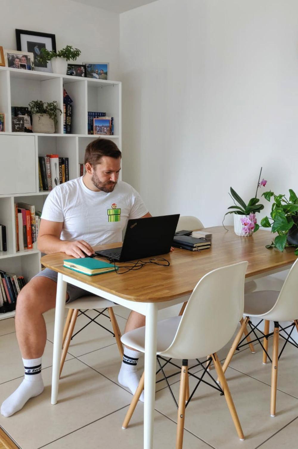 A man working from home in Primark clothing