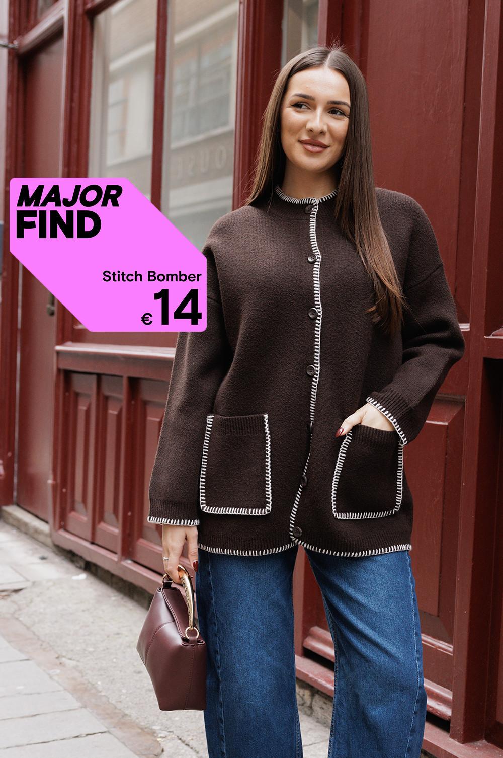 Brown stitch bomber jacket with white trim details and front pockets, priced at £12, shown with jeans and handbag.