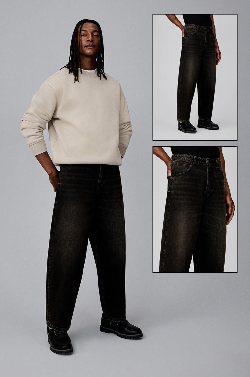 Mannequin portant un sweat-shirt crème avec un jean barrel noir et des chaussures noires. Gros plans du jean.