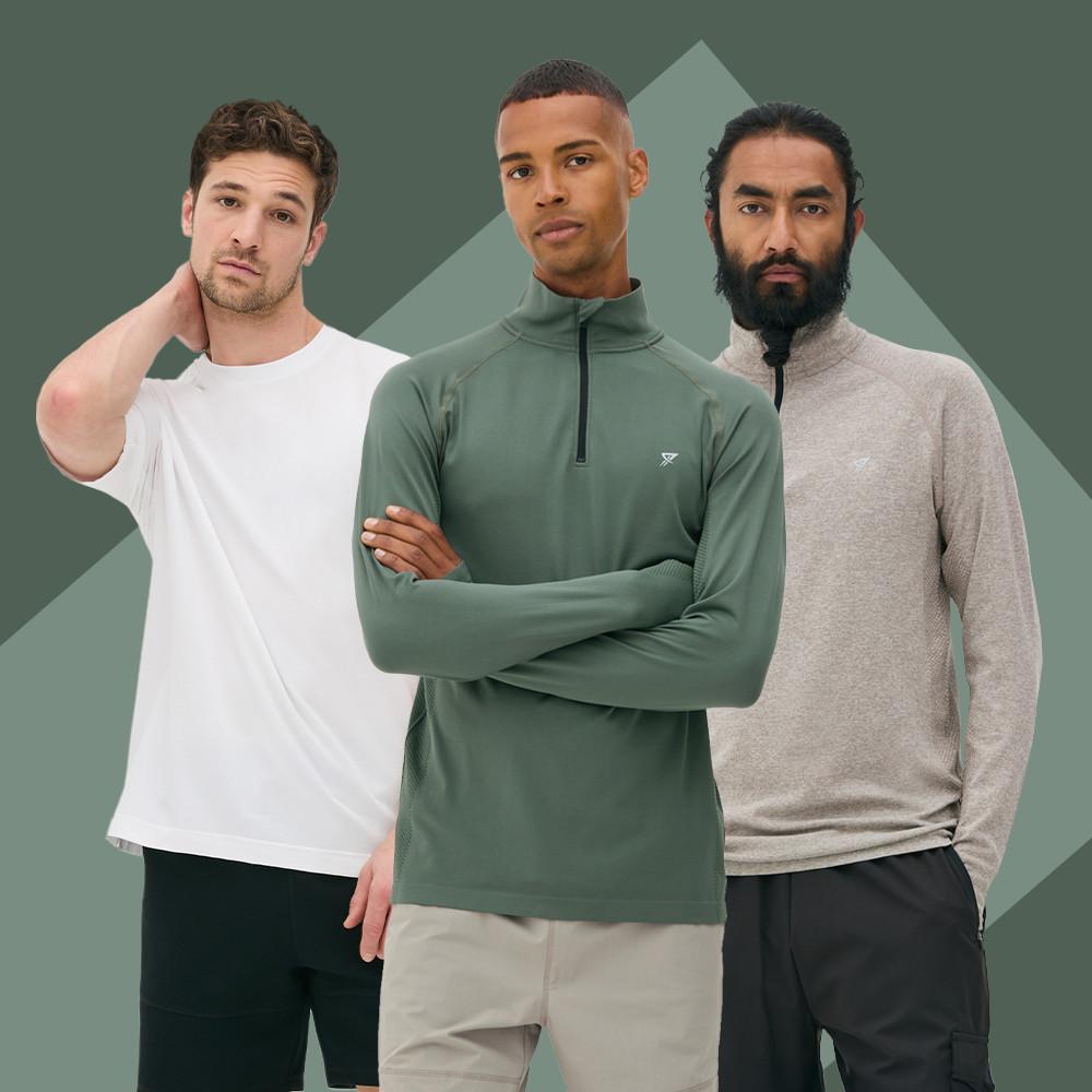Three men modeling athletic tops in white, green, and beige colors against a green background.