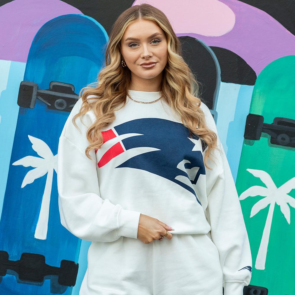 Woman in NFL sweatshirt, joggers