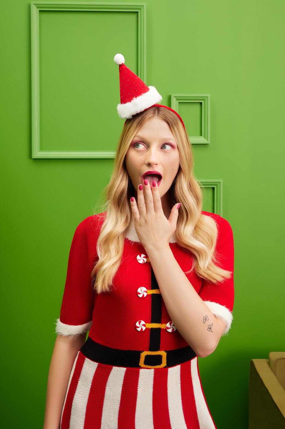 Model wears Mrs Claus knitted dress