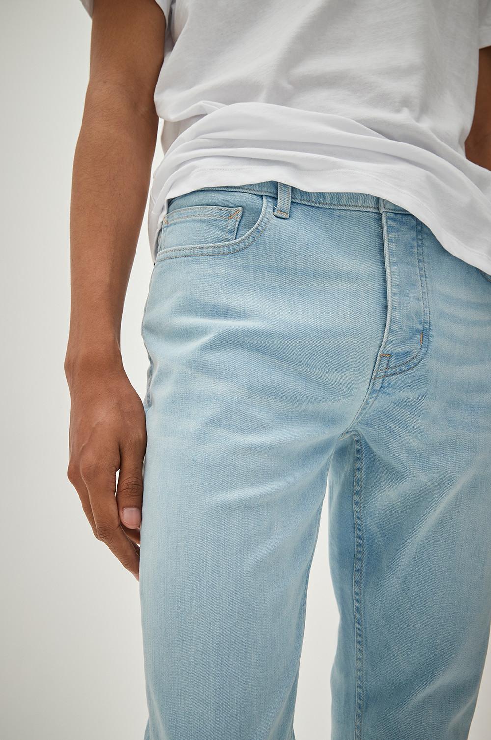 Model wearing light denim jeans