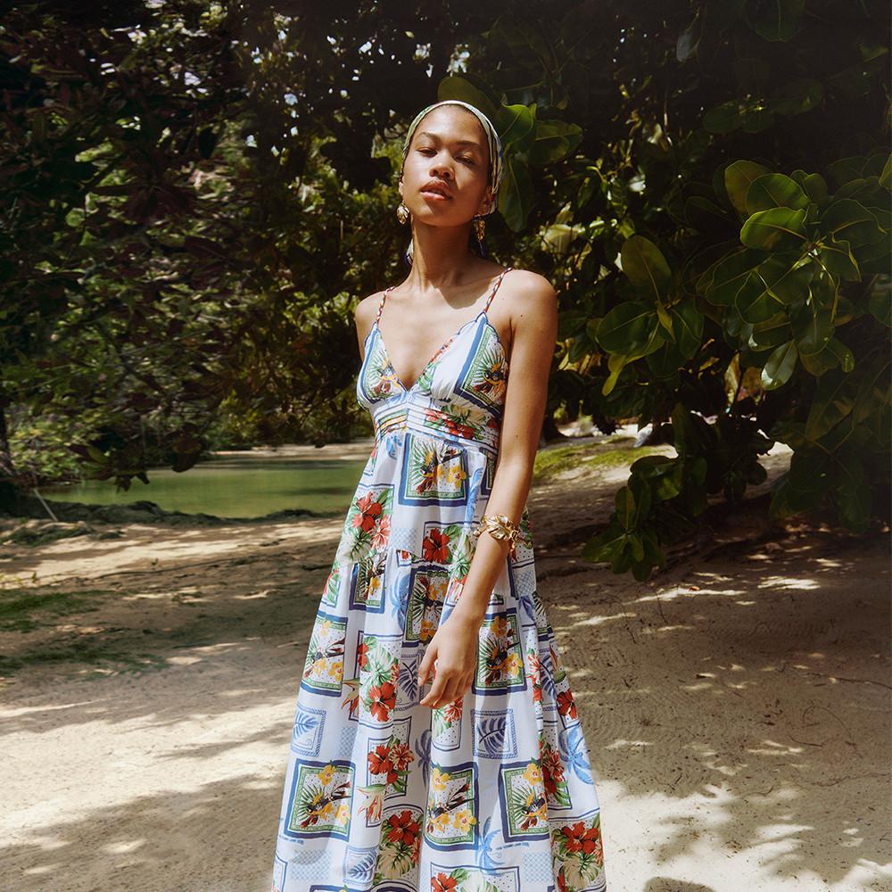 Model wears printed dress