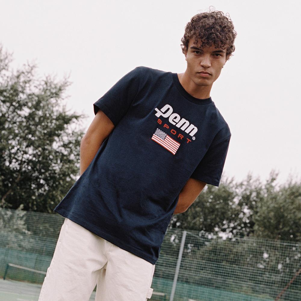 man wearing blue Penn t-shirt