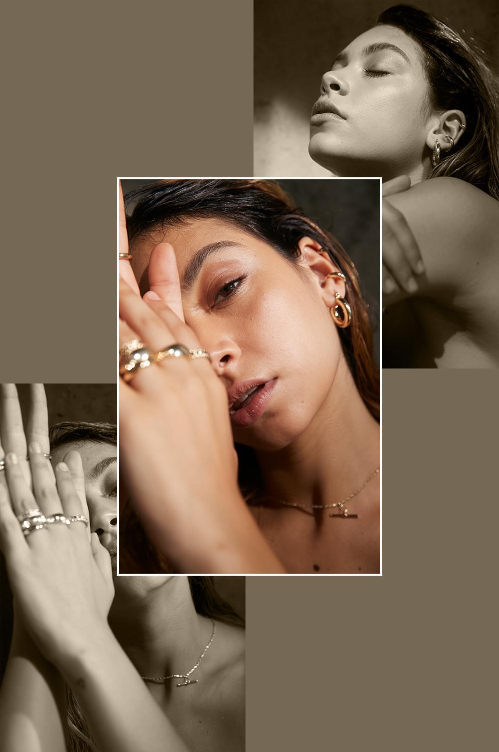 Model wearing gold plated rings