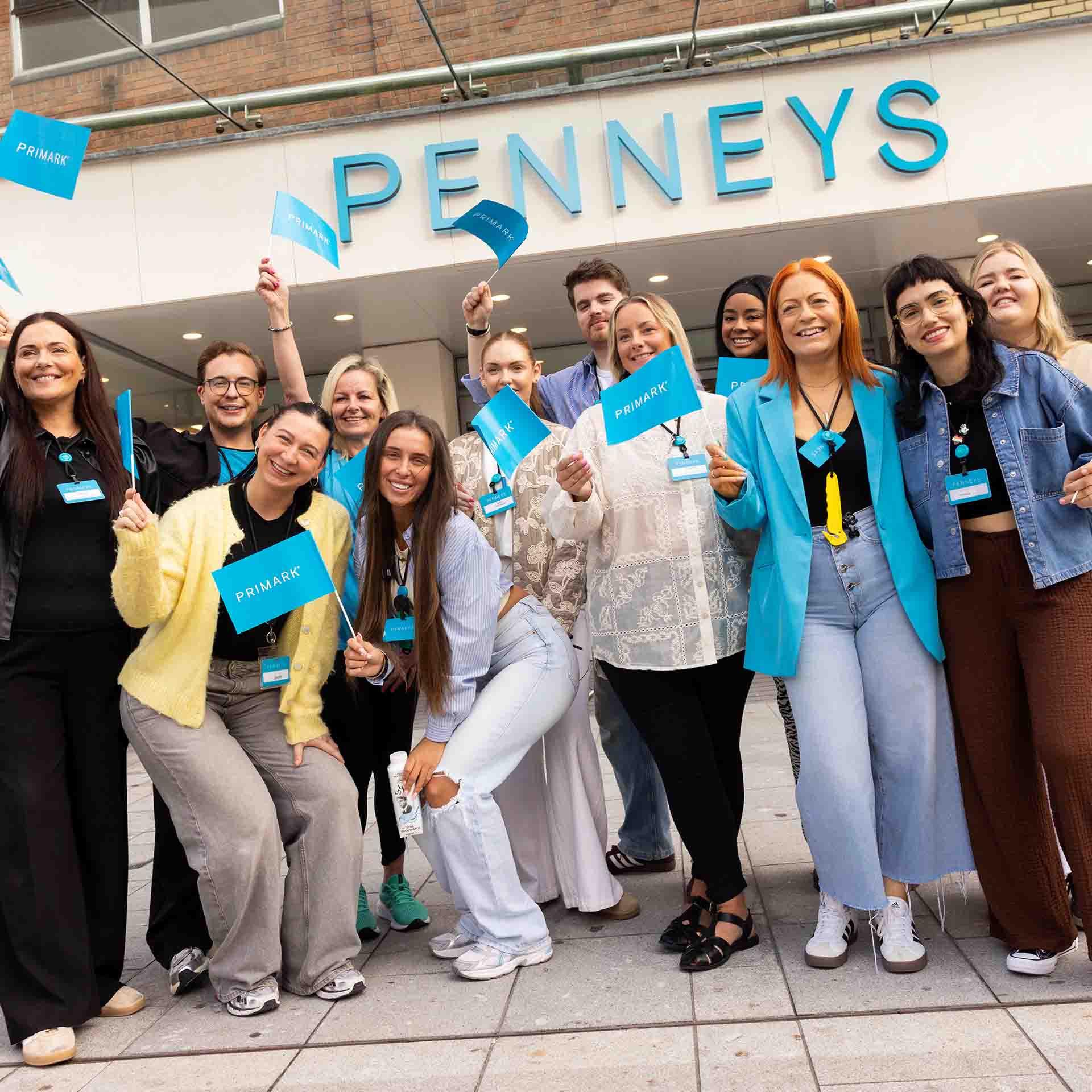 Happy Penneys employees standing outside the refitted O'Connell Street store.