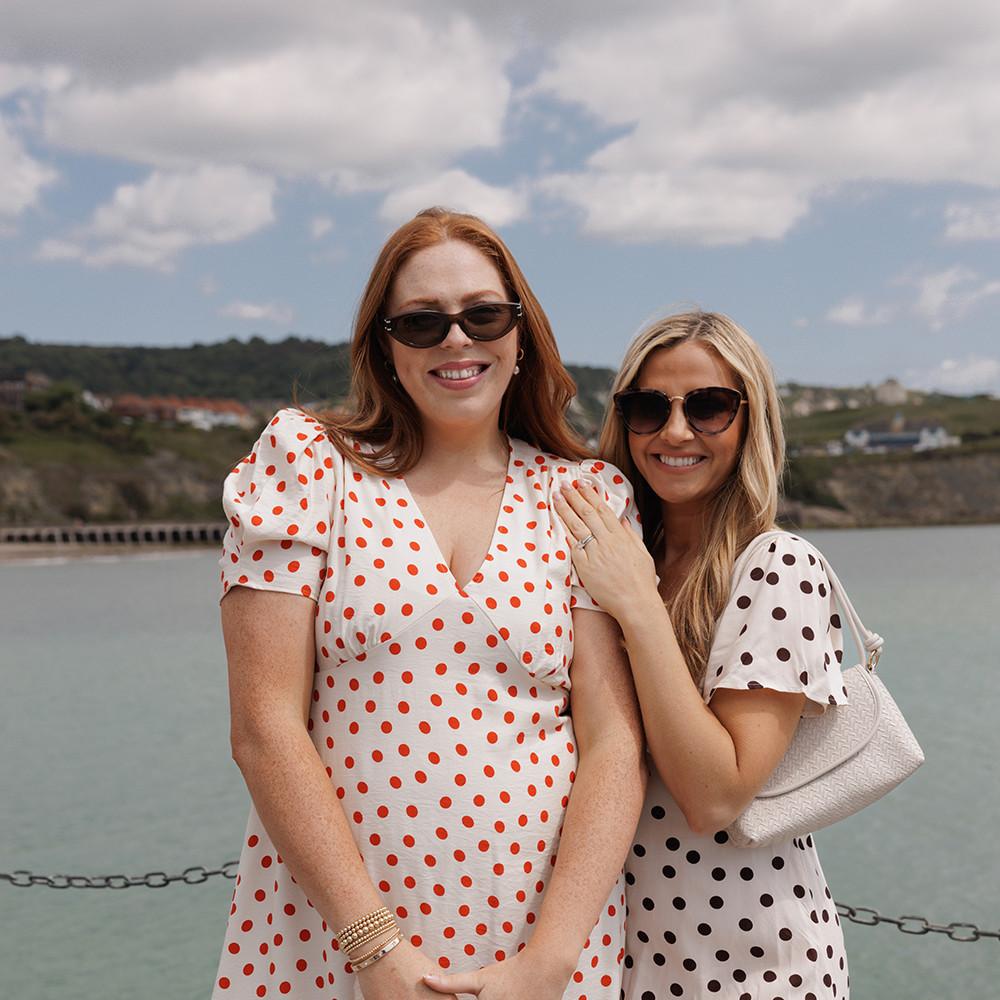 Models wear polka dot dresses in red and white and black and white