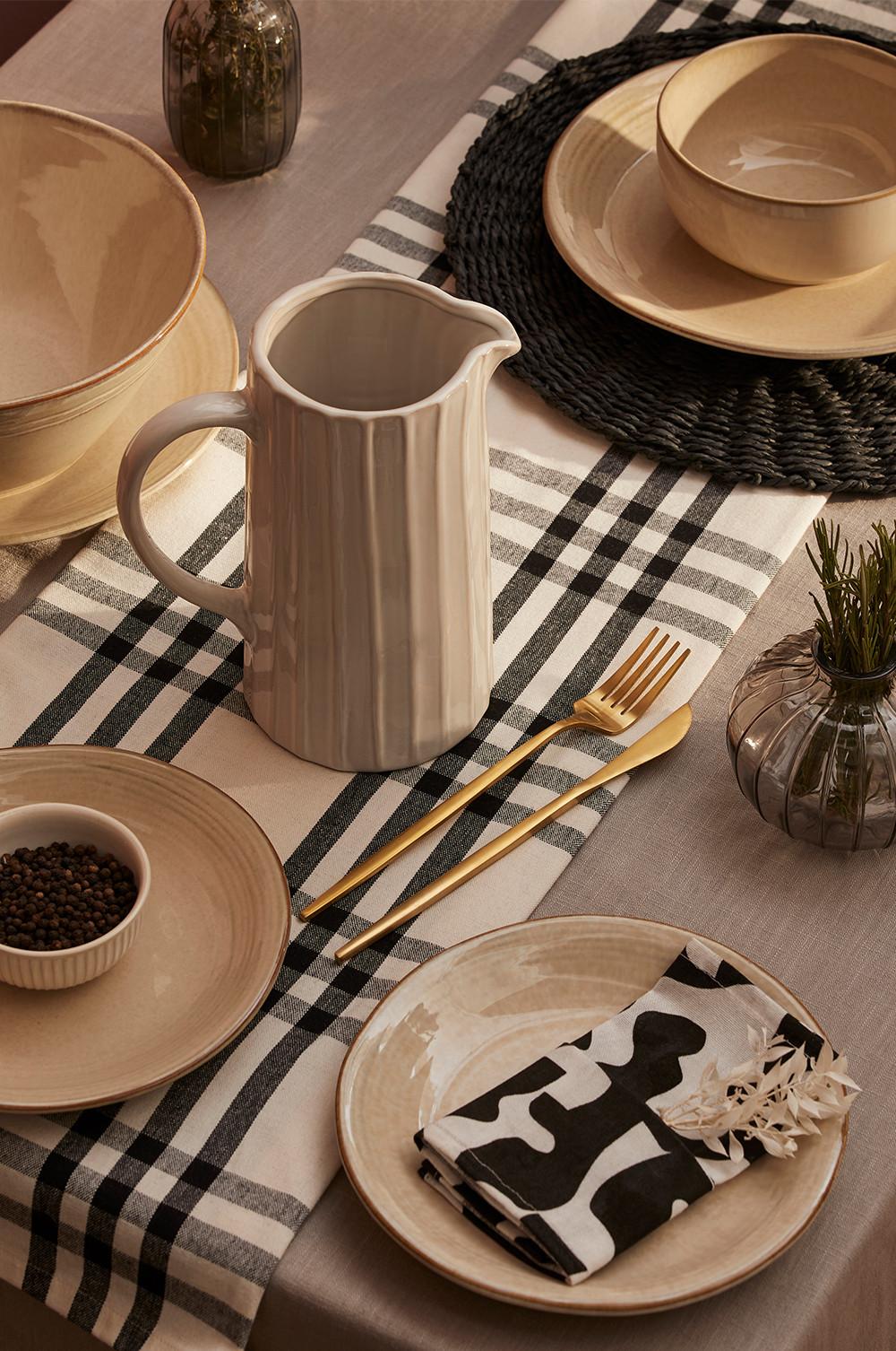 Black and white napkins, pitcher