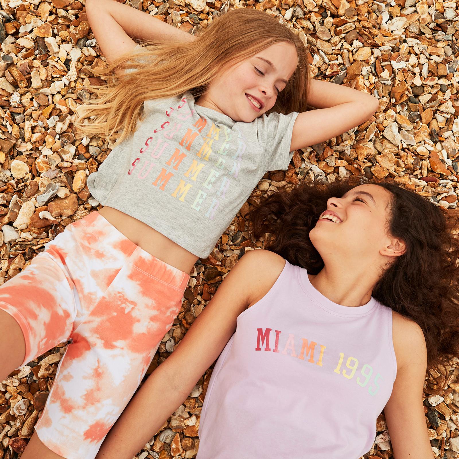 Kids wear pastel graphic and tie-dye outfits