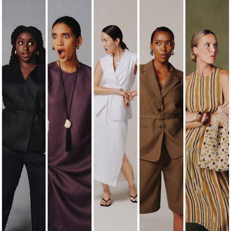 Five women in stylish outfits each exude surprise. Attire ranges from dark suits to light dresses.