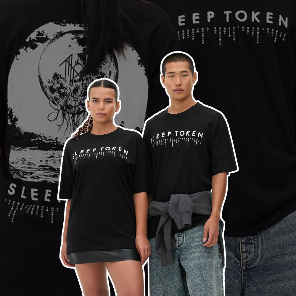 Two models wearing black SLEEP TOKEN T-Shirts with distinctive graphic design. Background shows enlarged logo detail.