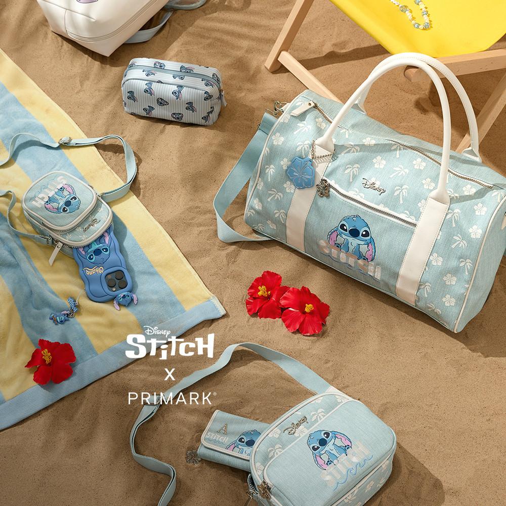 Lilo and Stitch merch such as week-end bag, beach towel, make-up bag and phone case placed in a beach set