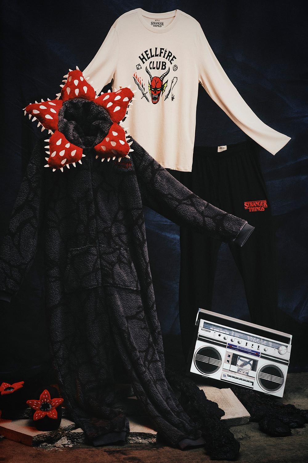 Stranger Things merchandise featuring a Demogorgon costume, Hellfire Club T-shirt and vintage radio.