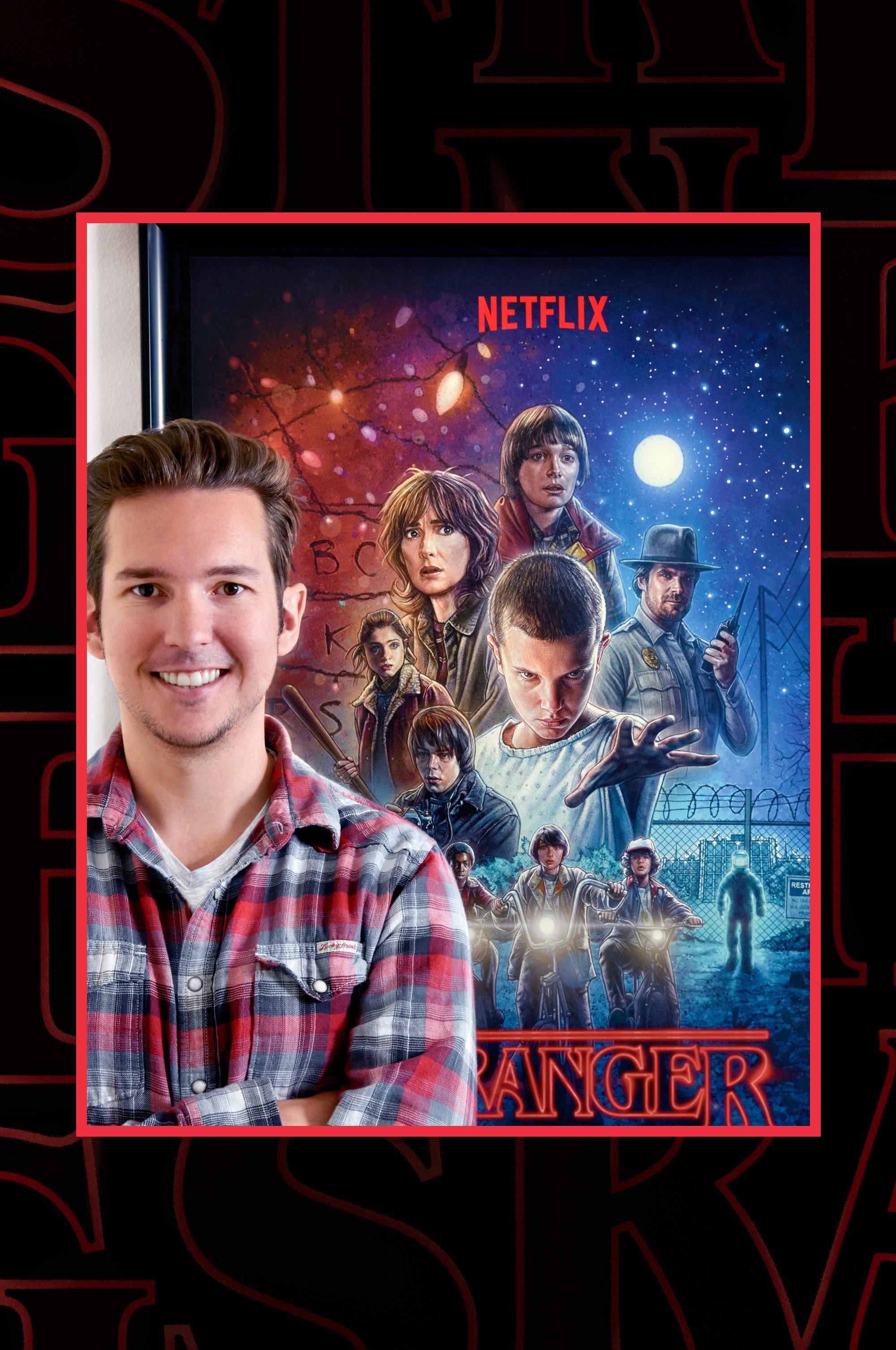 Kyle Lambert and the Stranger Things poster behind